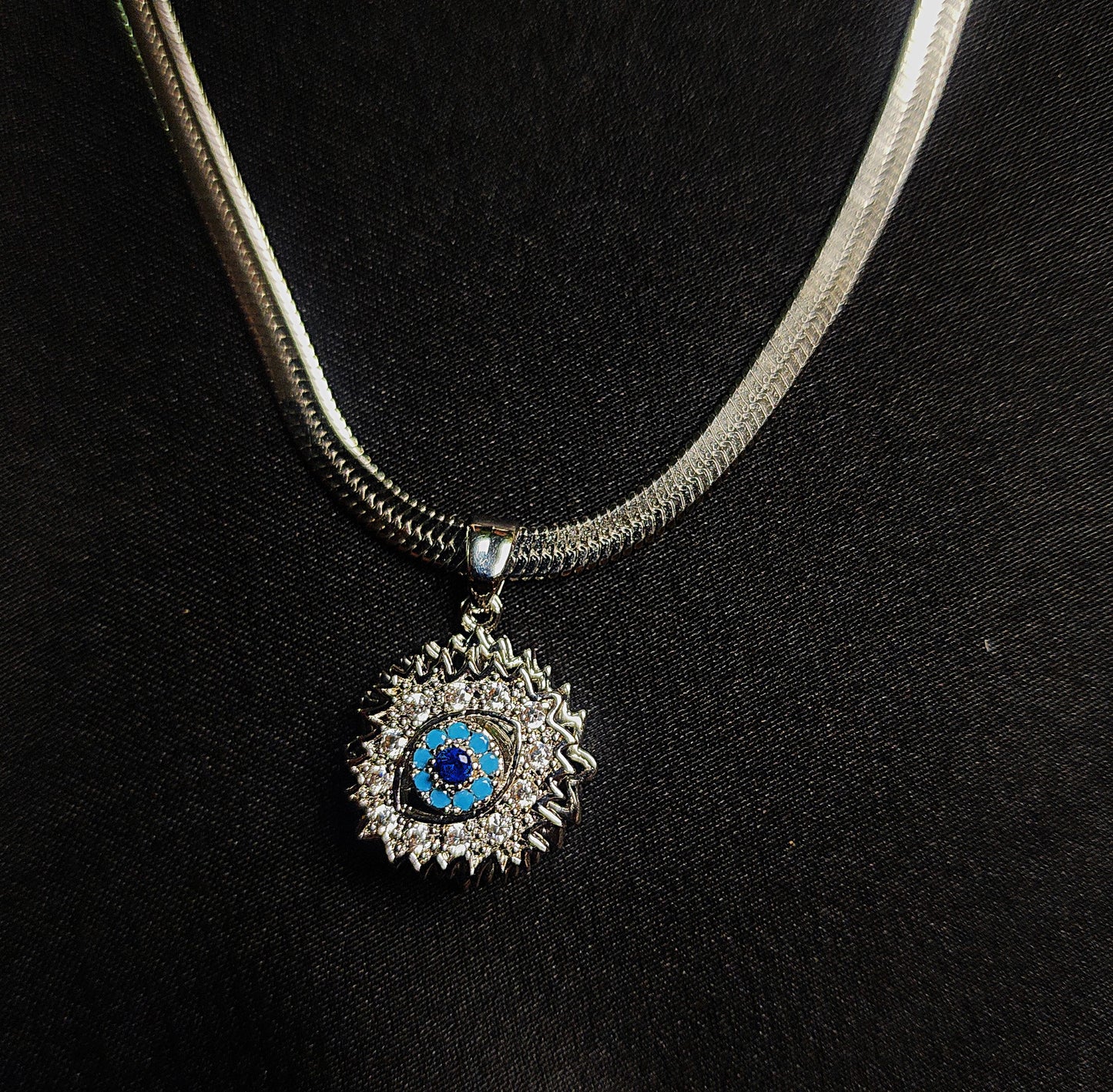 snake chain with eye stone locket