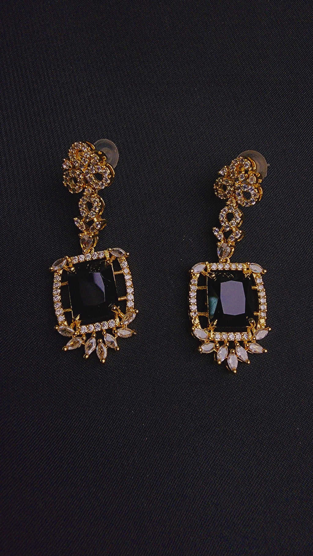 Striking black central stone, intricately framed by sparkling cubic zirconia EARRINGS