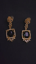 Striking black central stone, intricately framed by sparkling cubic zirconia EARRINGS