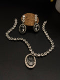 Necklace with a dazzling oval pendant and a matching pair of drop earrings